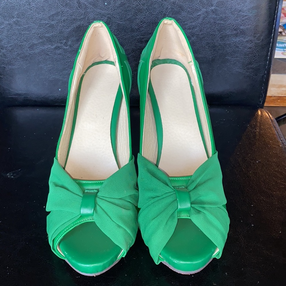 Green heels with red bottom